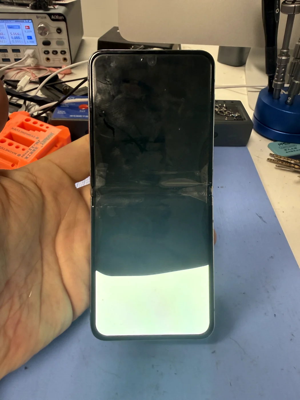 Cracked Samsung Galaxy Z Flip screen assessed before repair at FIXSTORY Downtown LA