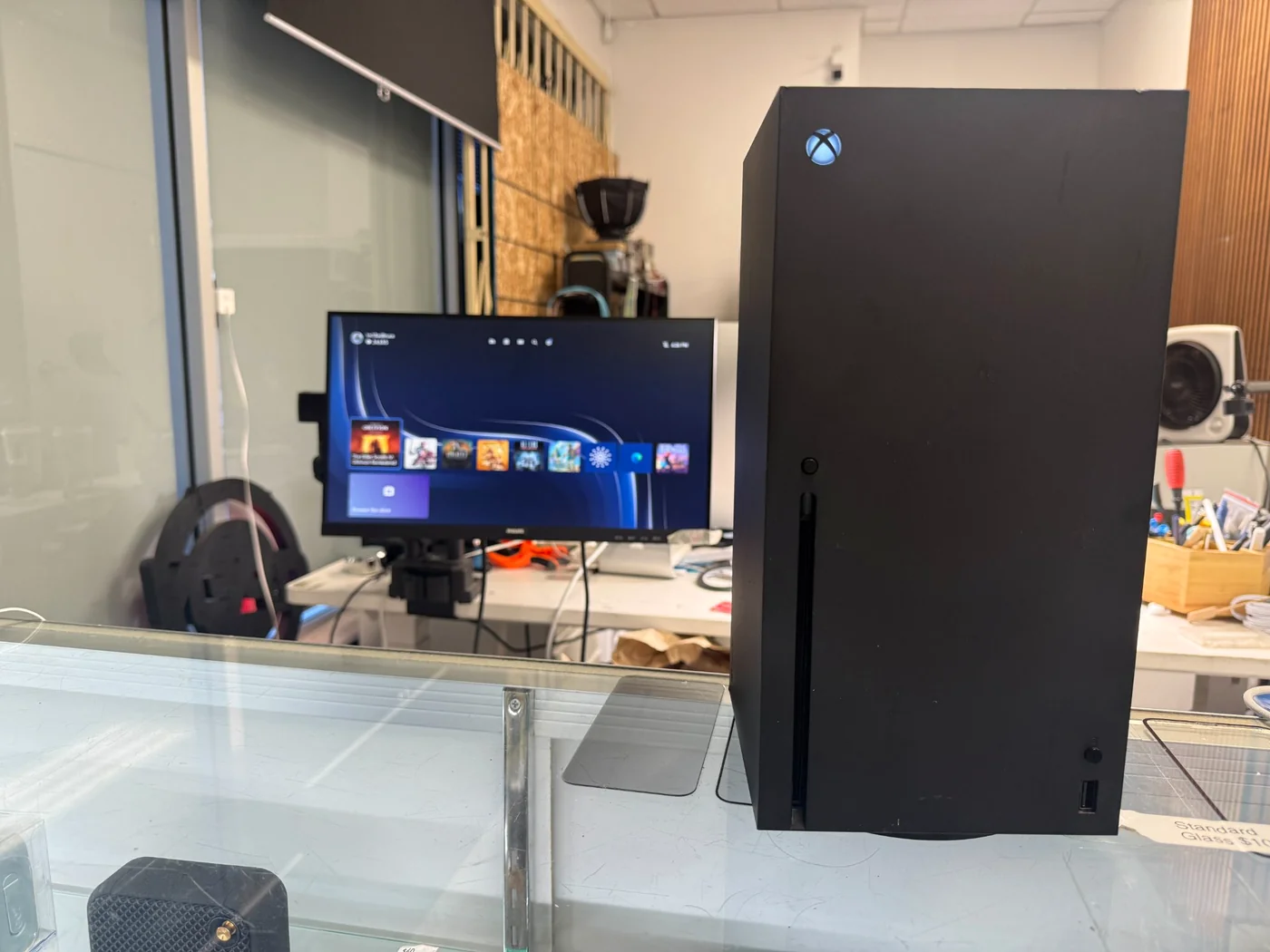 Xbox Series X booted to the home screen on the bench monitor after HDMI port replacement, signal restored