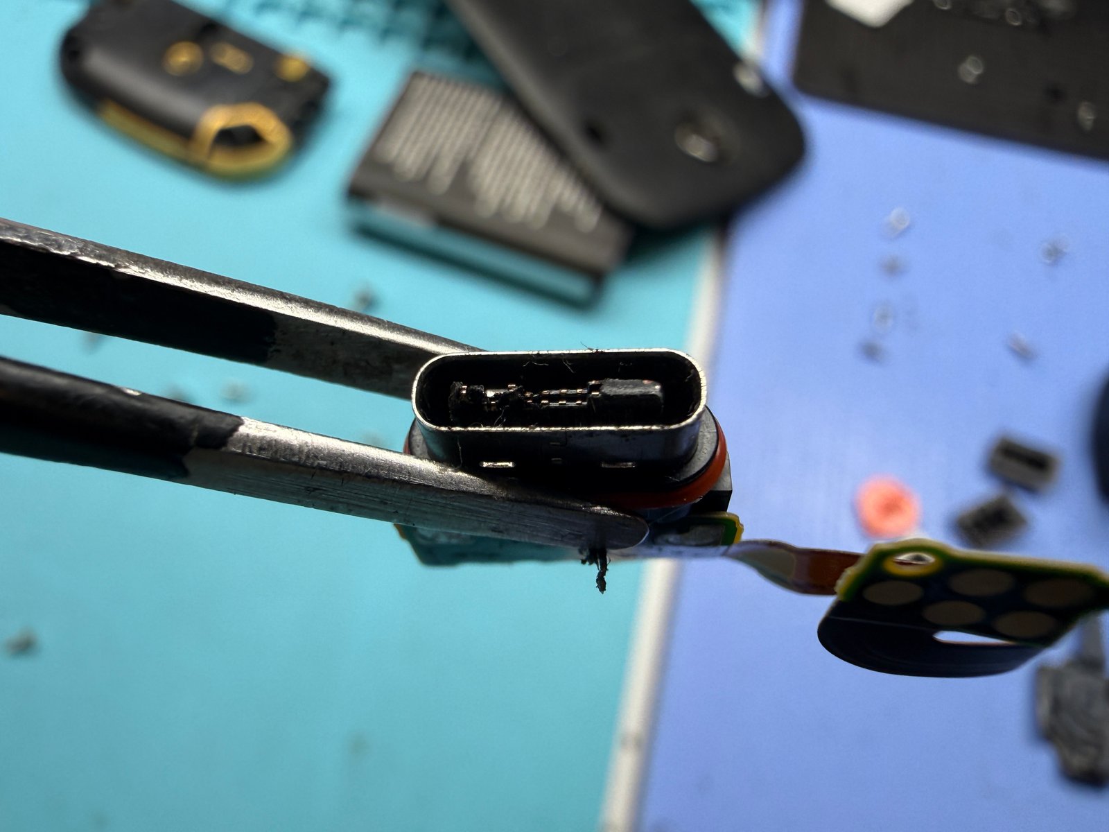 Damaged USB-C charging port flex removed from the Kyocera DuraXA E4831