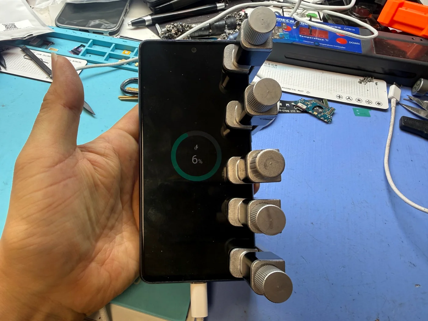 Samsung Galaxy S20 FE charging again on the bench after charging port and cable replacement at FIXSTORY in Downtown Los Angeles