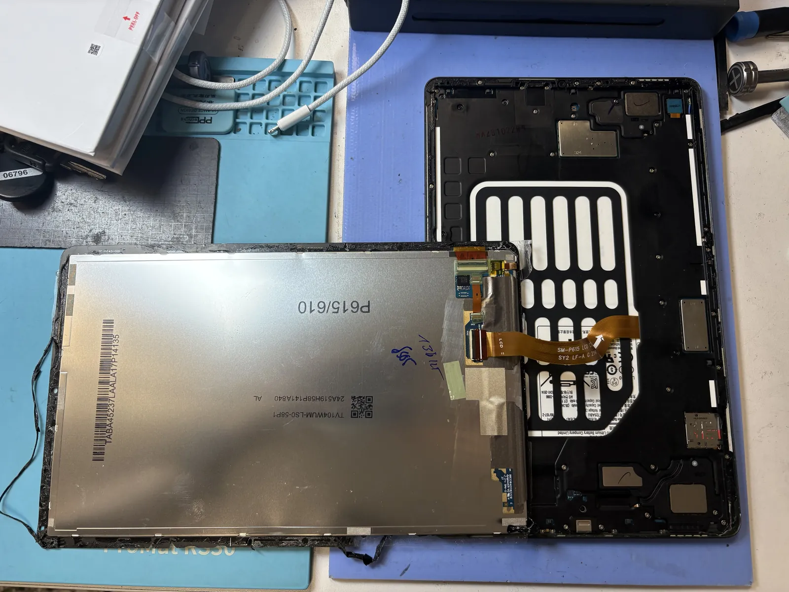 Galaxy Tab S6 Lite opened on the bench with the LCD panel lifted out of the chassis after the broken glass was removed