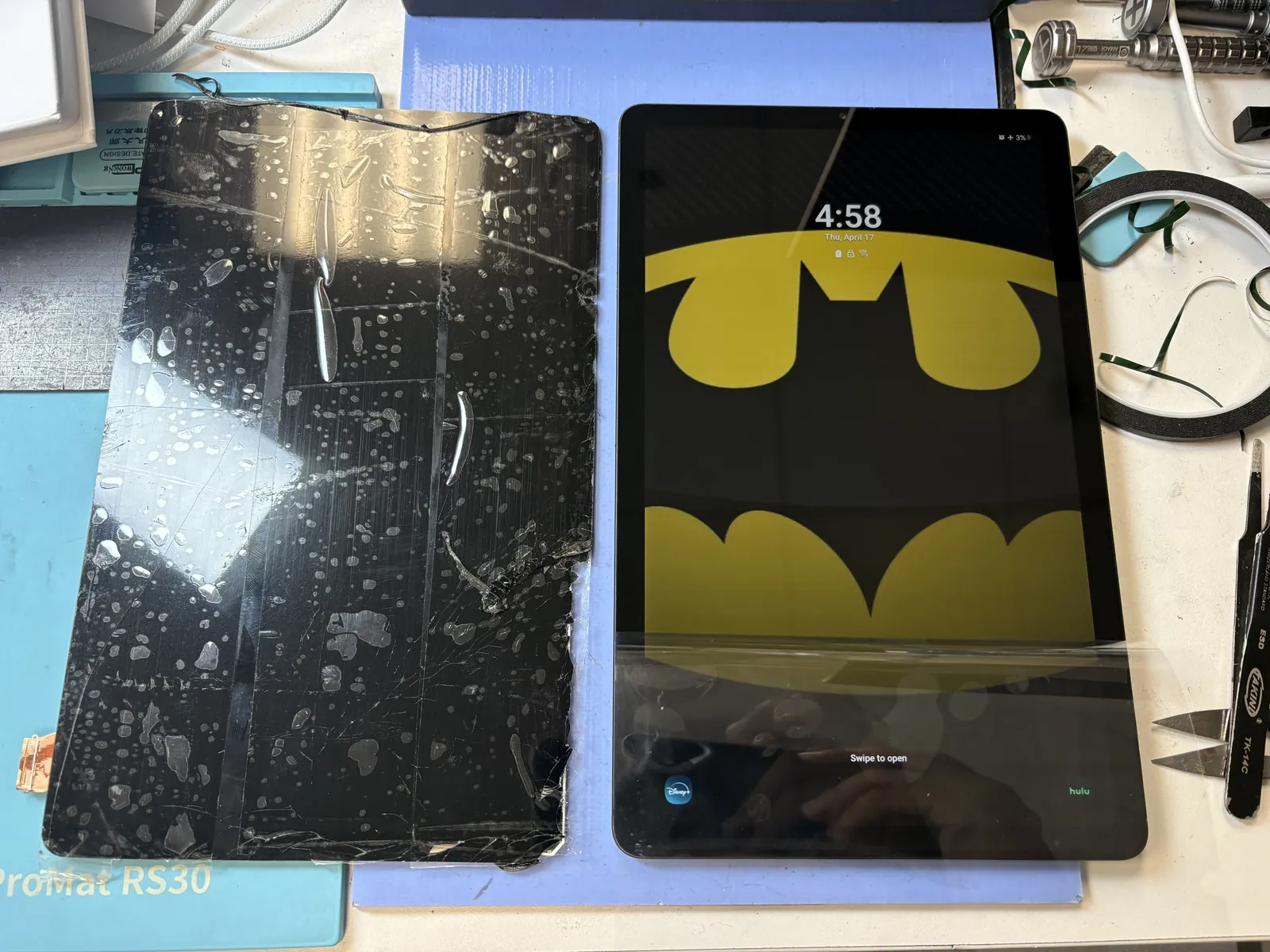 Finished Galaxy Tab S6 Lite screen replacement next to the removed broken screen assembly at FixStory in Downtown Los Angeles