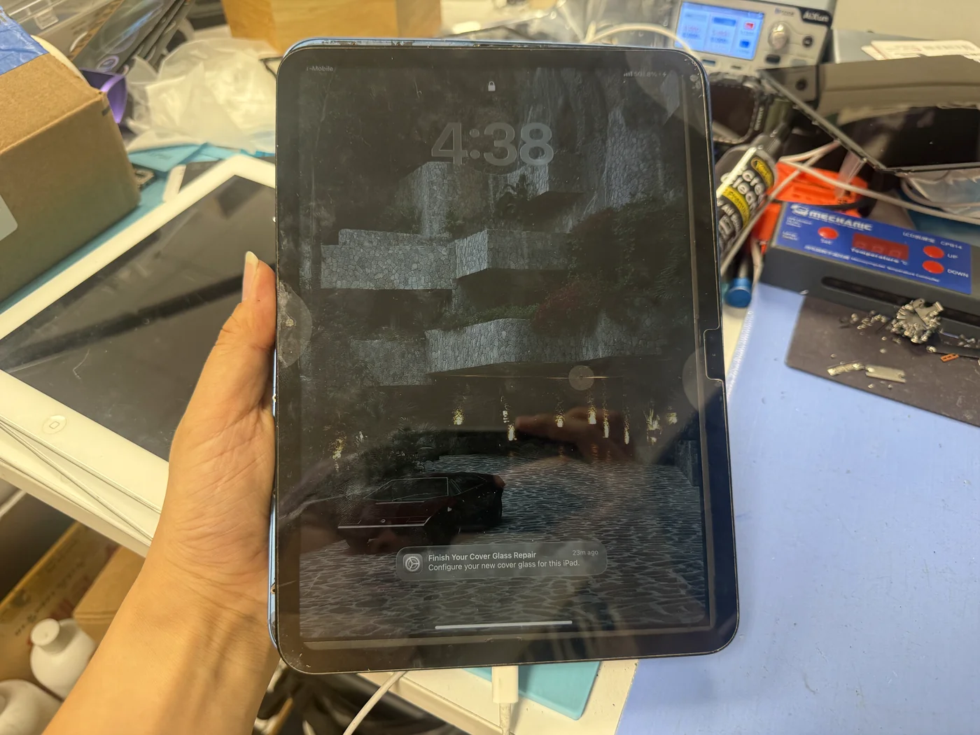 iPad 11-inch (2025) booted to the lock screen on a genuine test display, data intact