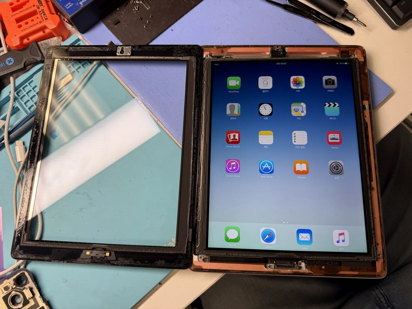 iPad 3 powered on and showing its home screen after battery replacement at FIXSTORY DTLA in Los Angeles