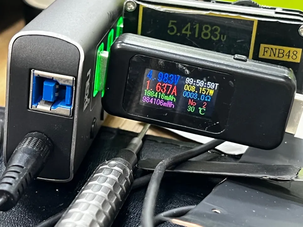 USB meter showing 1.637 amps flowing into the iPad 7th gen after the chip replacement