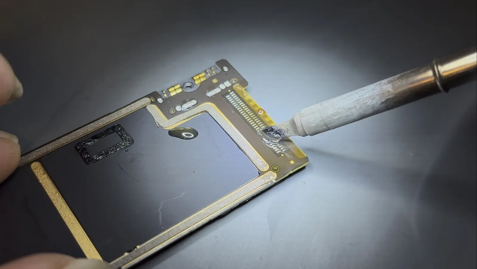 Fresh solder applied to every pad where the old iPad Air 4 charging port sat