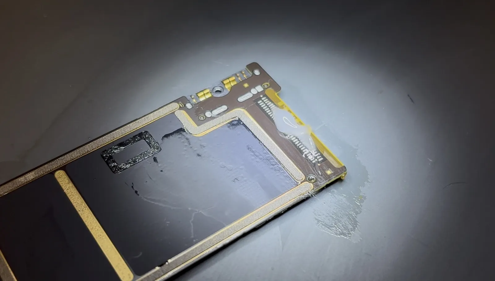 Flux applied to the prepared pads so the new iPad Air 4 port solders cleanly