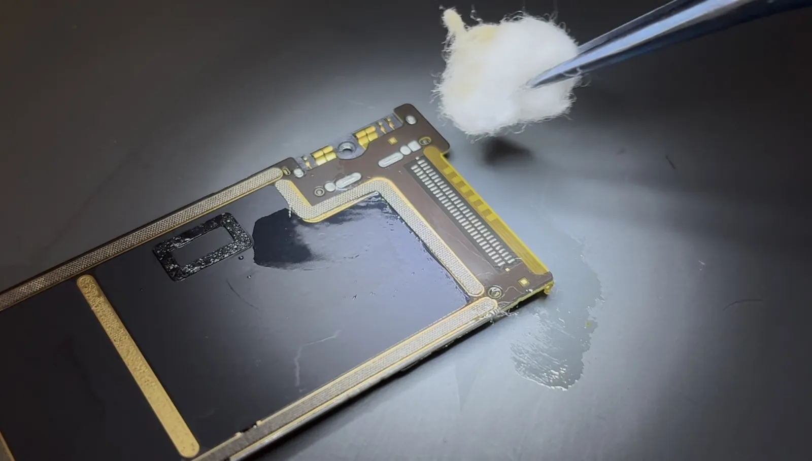 Cleaning the solder area on the iPad Air 4 board before fitting the new port