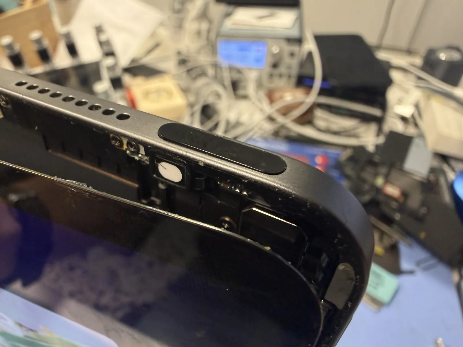 iPad Air 4 corner after a drop with the power button pressed into the bent frame