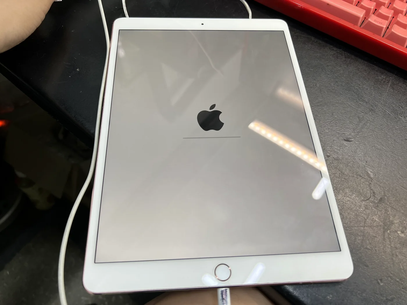 iPad Pro 10.5 booting with the Apple logo after the loose power coil was re-soldered