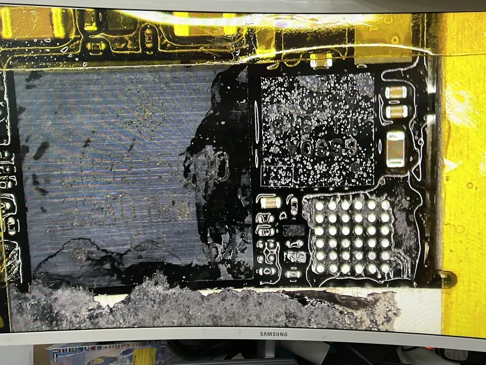 Close-up of the iPad Pro 11 charging circuit after the smaller chip was removed