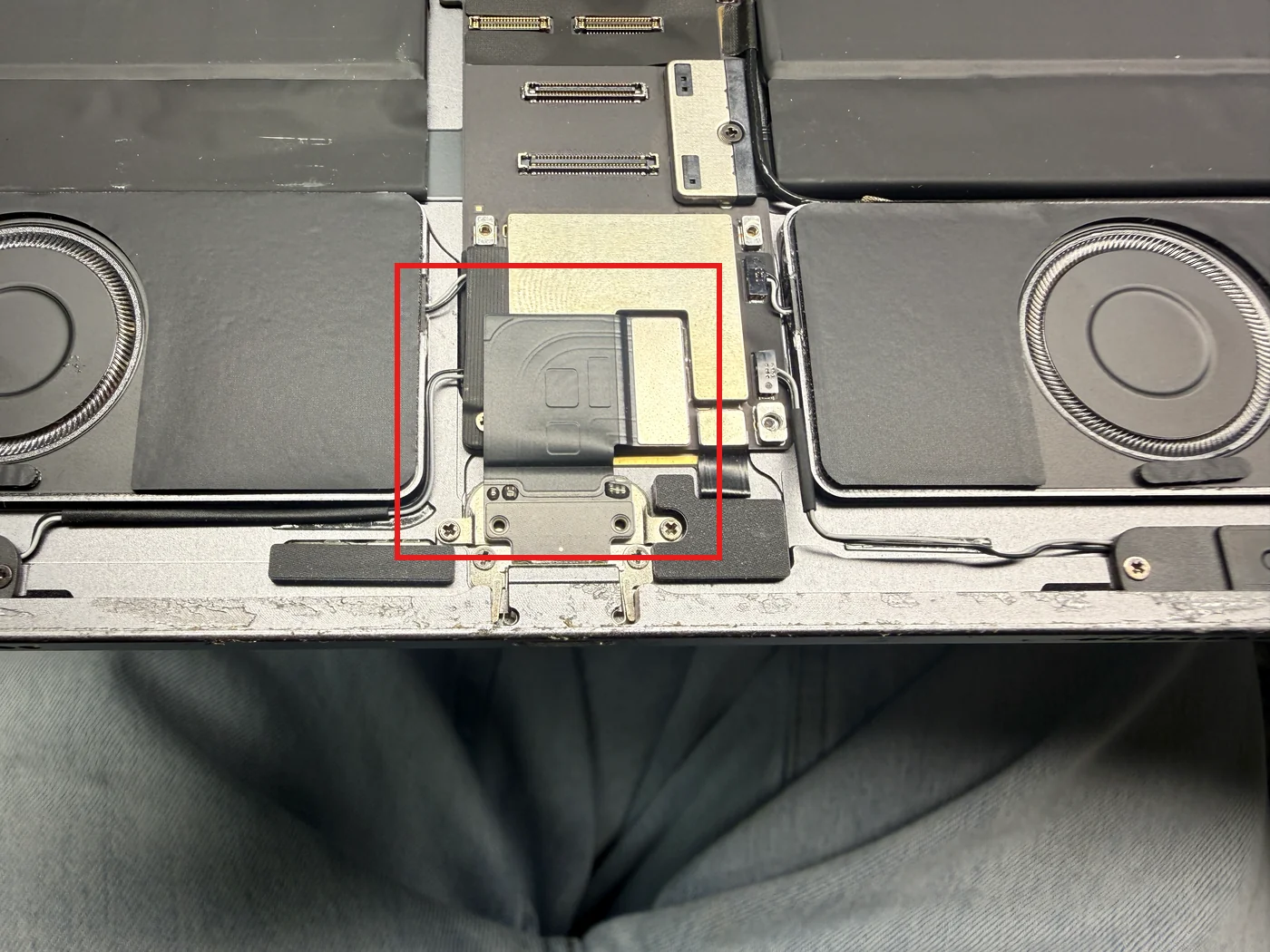 iPad Pro 12.9 3rd gen charging port location marked with a red box, showing its flex connected to the logic board