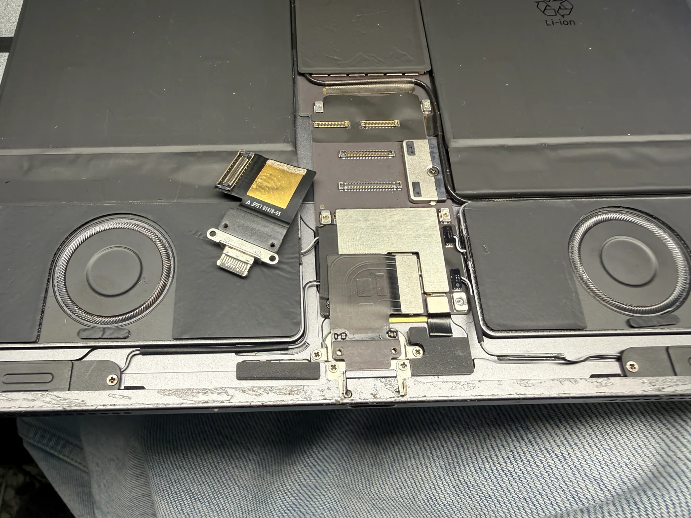 New charging port being fitted into position in an iPad Pro 12.9 3rd gen