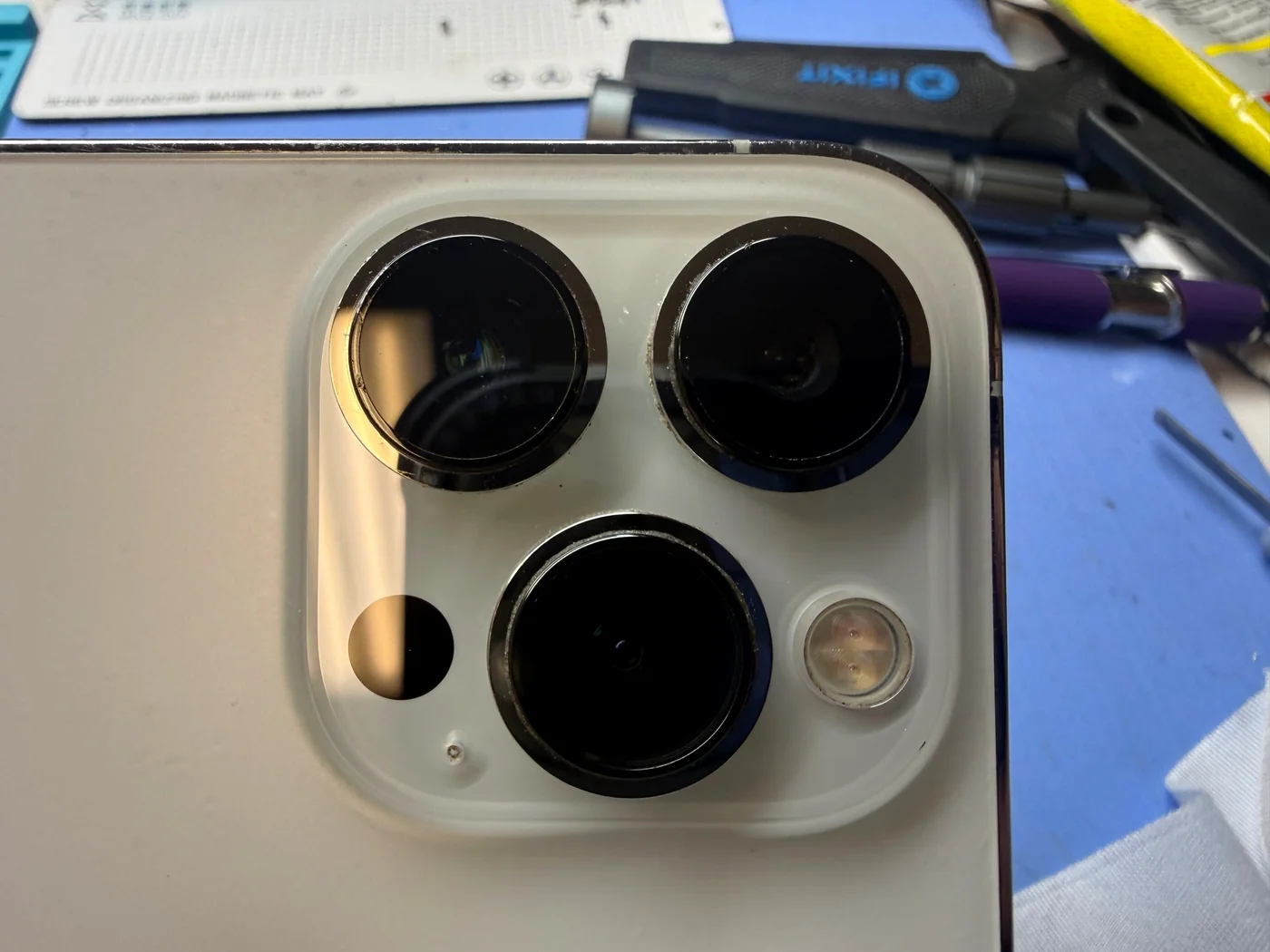 iPhone 14 Pro rear camera with new genuine Apple lens cover glass installed at FIXSTORY in Downtown Los Angeles