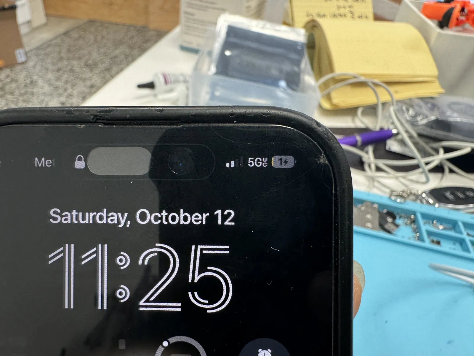 iPhone 14 Pro lock screen showing the charging bolt again after the port replacement