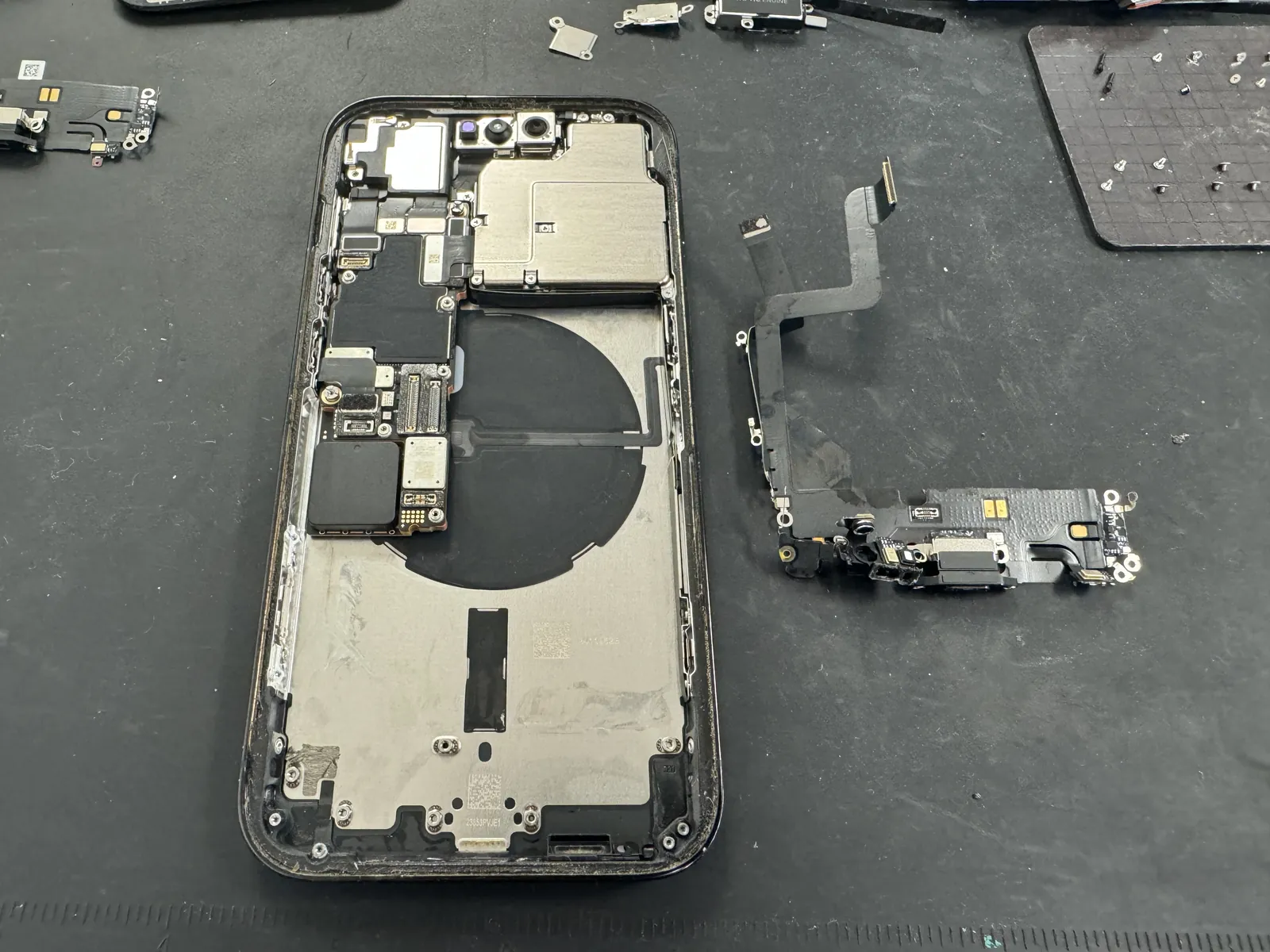 The faulty charging port flex removed from the iPhone 14 Pro housing