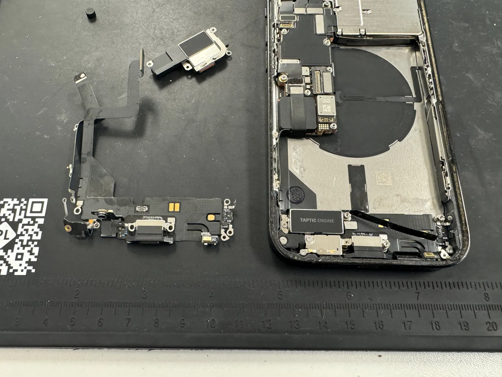 New genuine Apple charging port being fitted into the iPhone 14 Pro