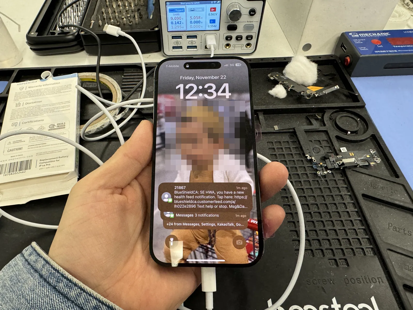 Repaired iPhone 14 Pro back on and charging at the FixStory bench in Downtown Los Angeles after a charging IC board repair