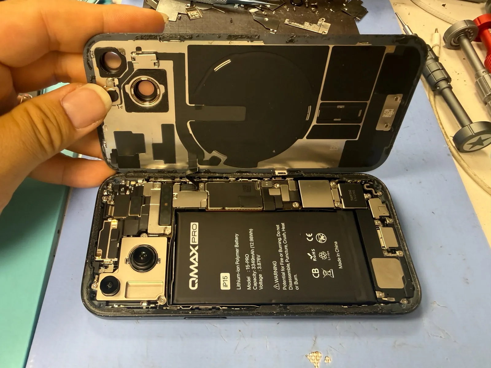 New aftermarket battery installed inside the iPhone 15