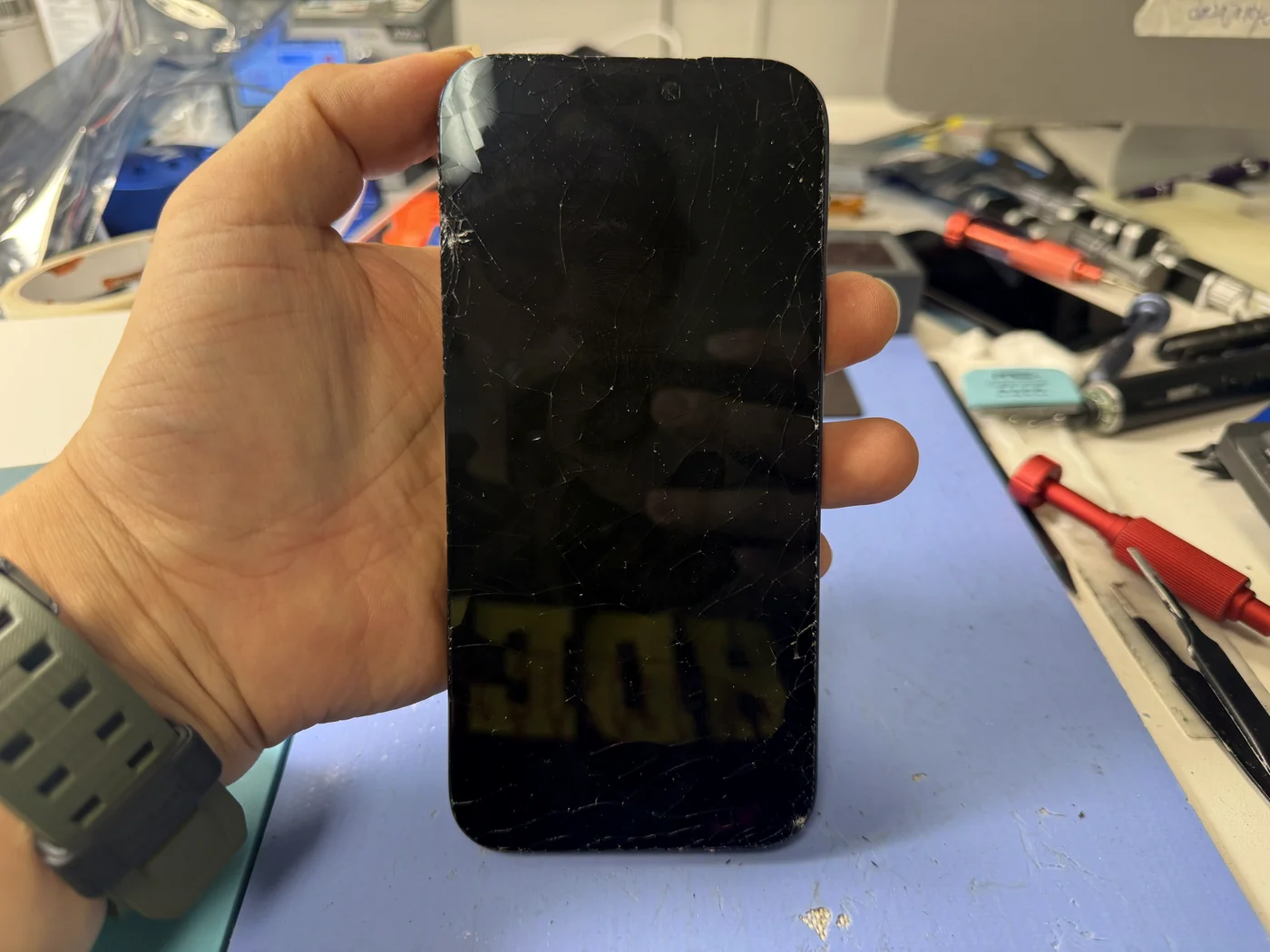 iPhone 17 Pro Max with a shattered screen checked in for screen replacement at FIXSTORY DTLA in Downtown Los Angeles