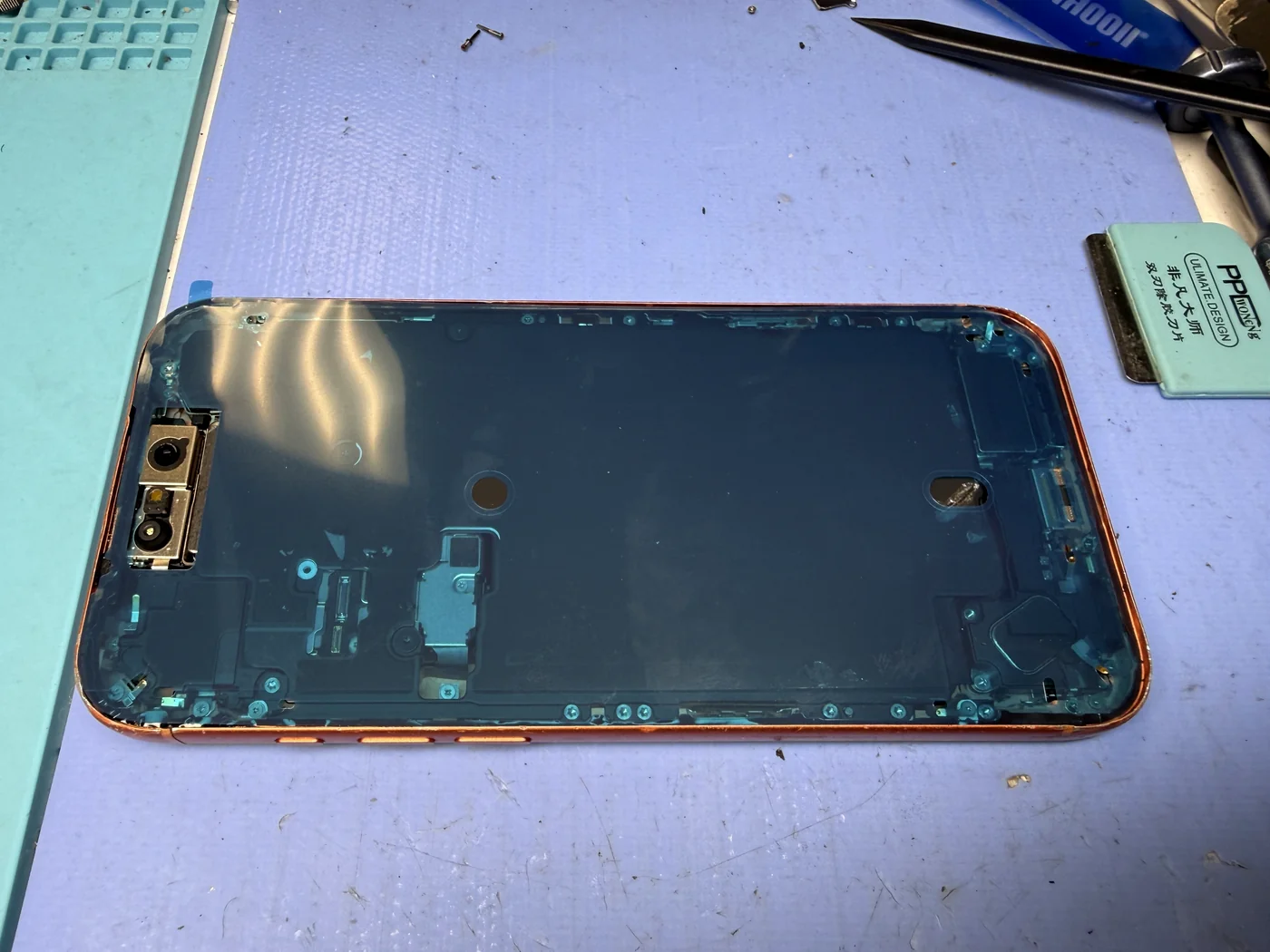 New waterproof seal applied to the iPhone 17 Pro frame before the screen goes on