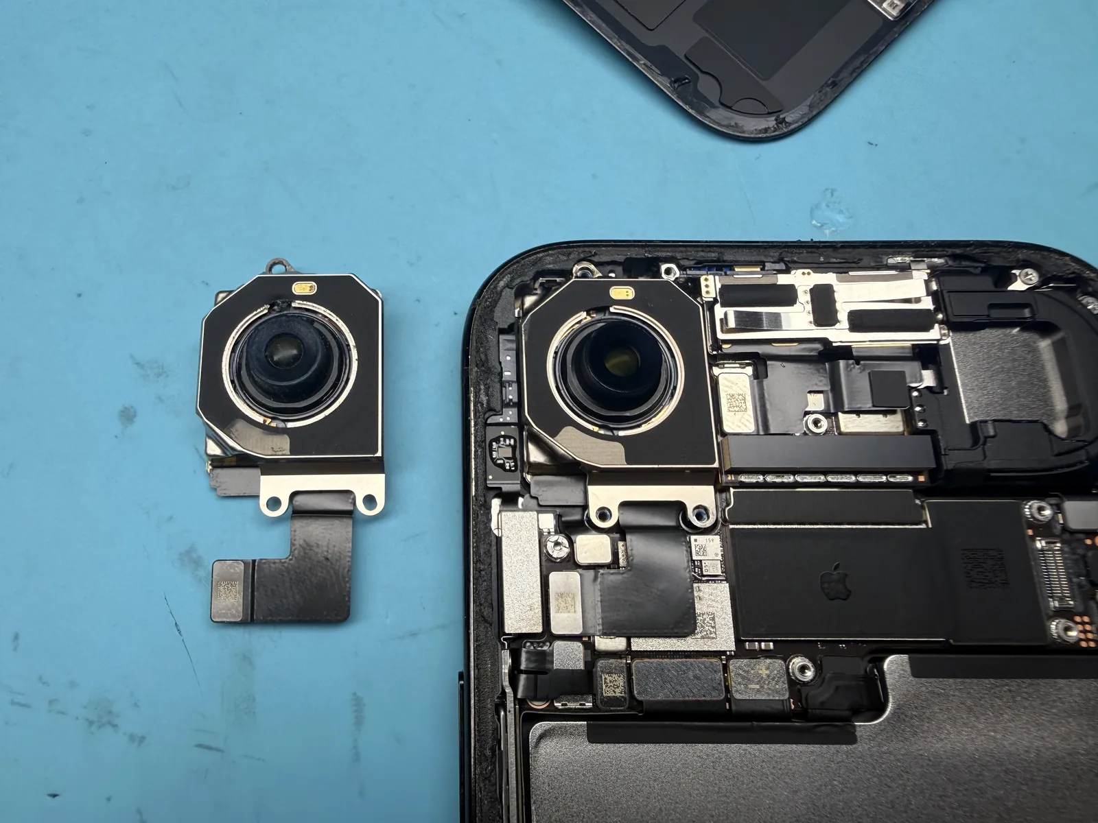 The new genuine Apple camera seated in the iPhone Air with the old one removed
