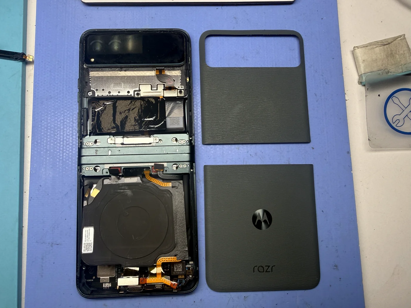 Motorola Razr 40 with both back covers removed at the start of inner screen replacement