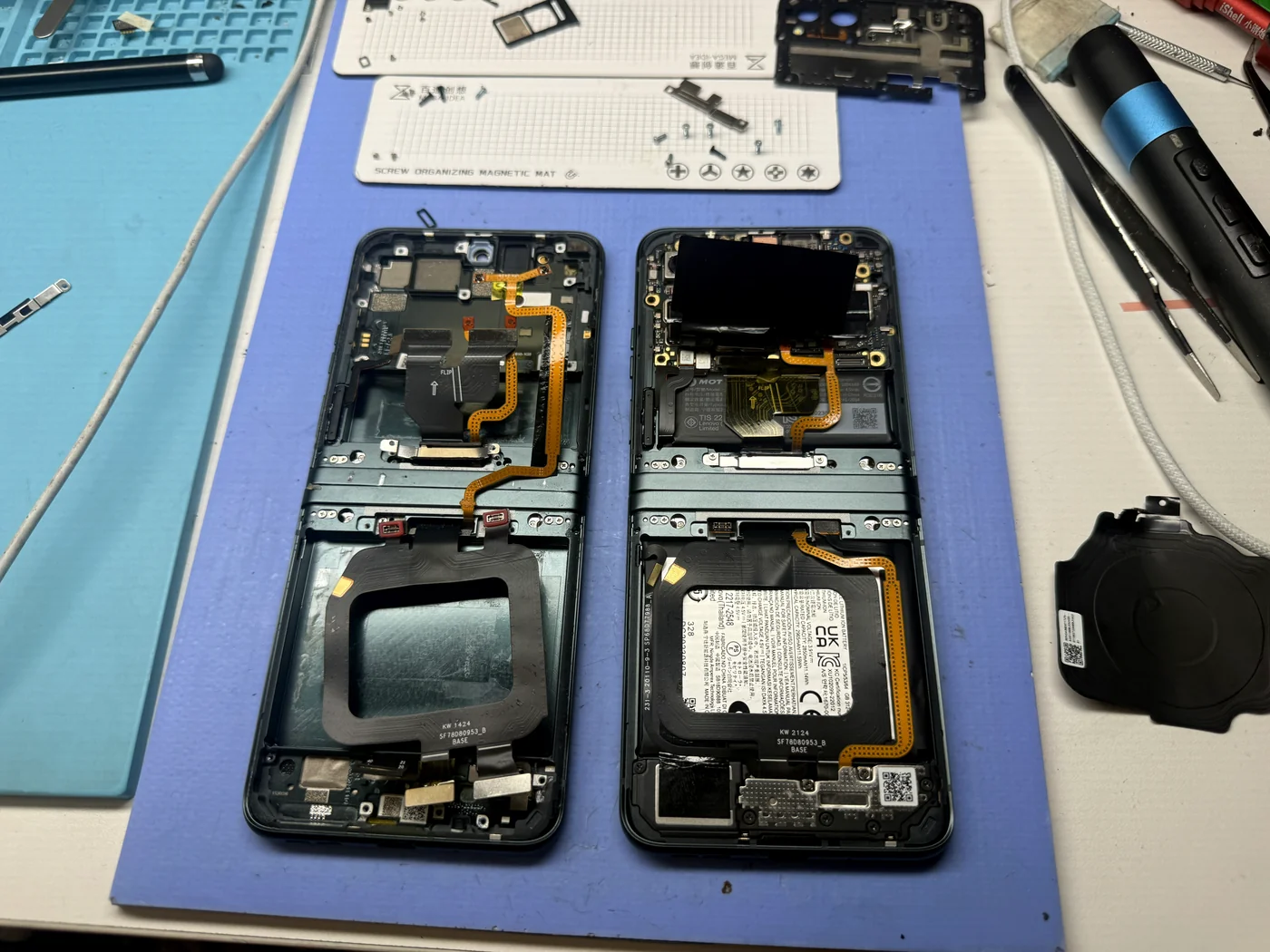 Old Motorola Razr 40 frame beside the new inner screen assembly with battery and internals transferred