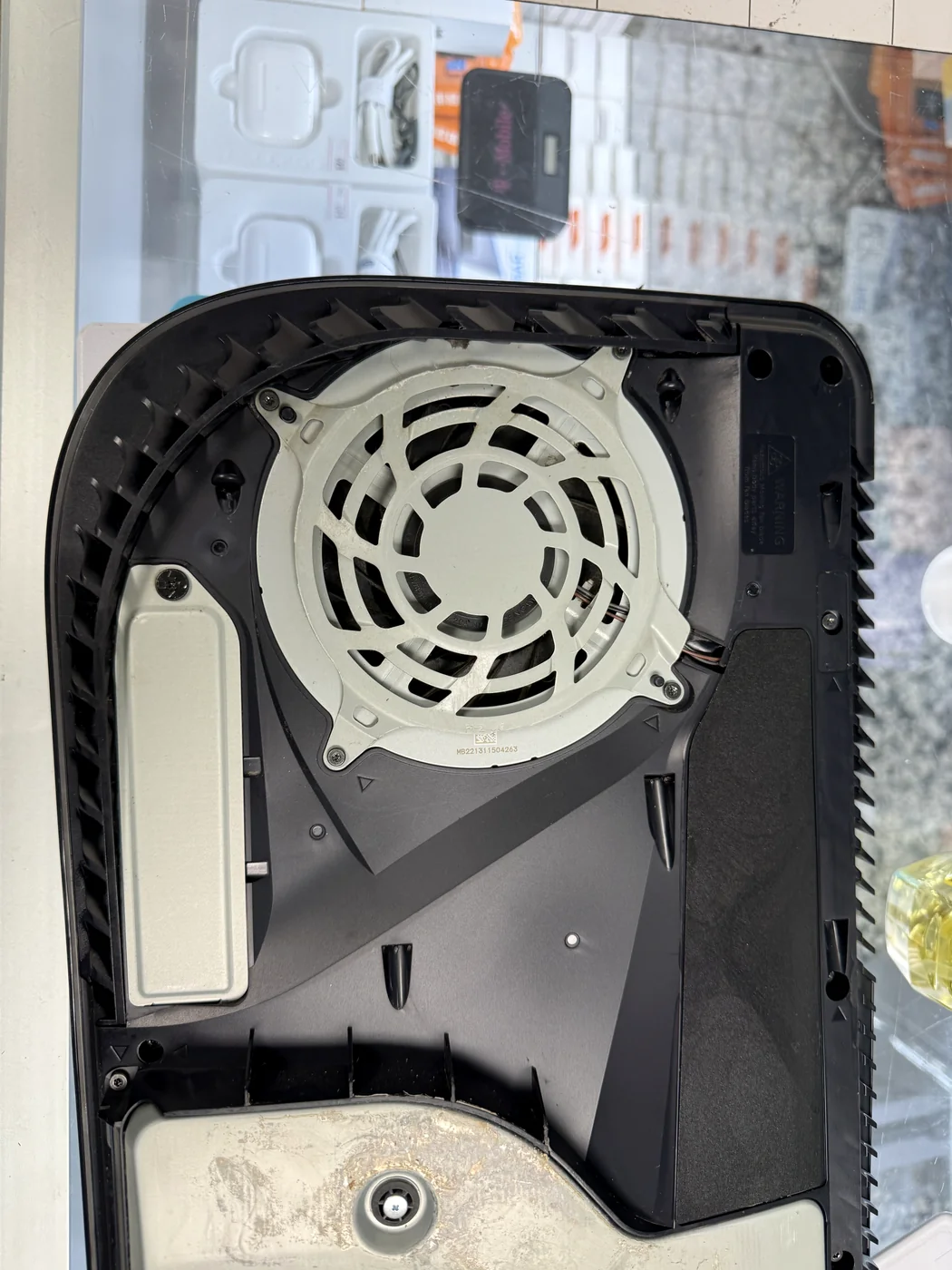 PS5 cooling fan and interior after deep cleaning, dust removed
