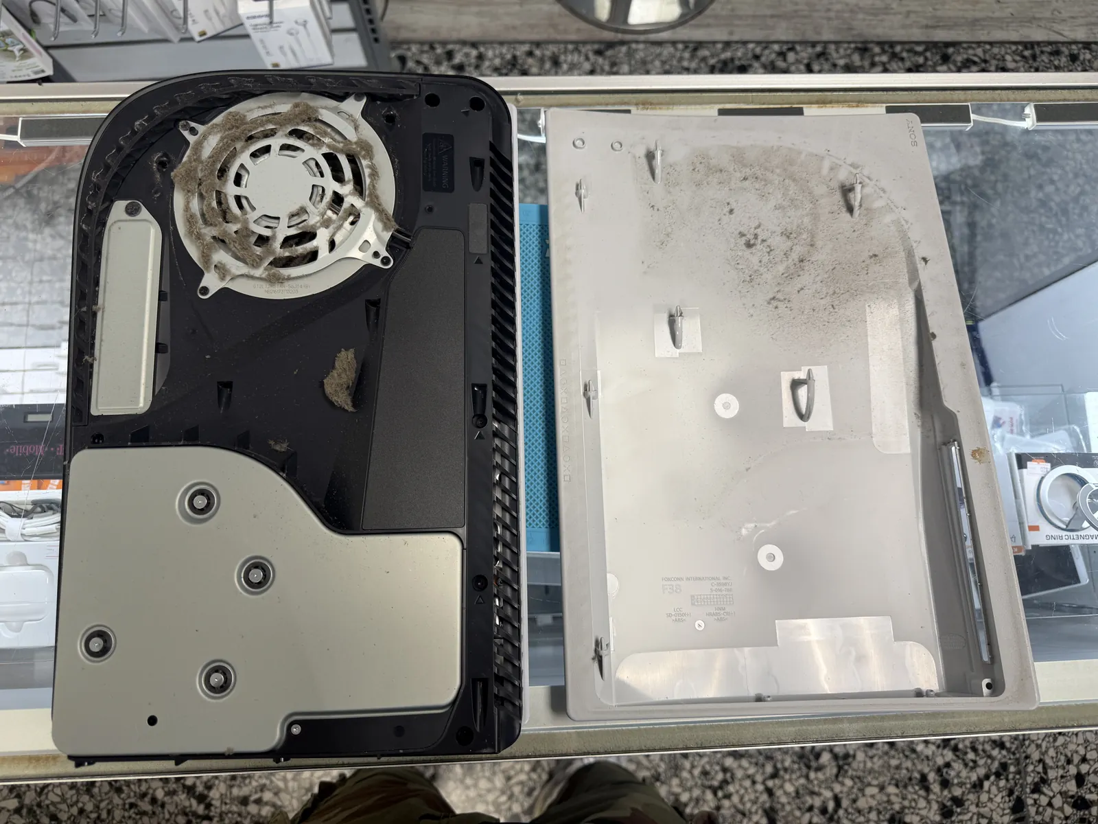 PS5 side cover removed, dust showing on the intake fan
