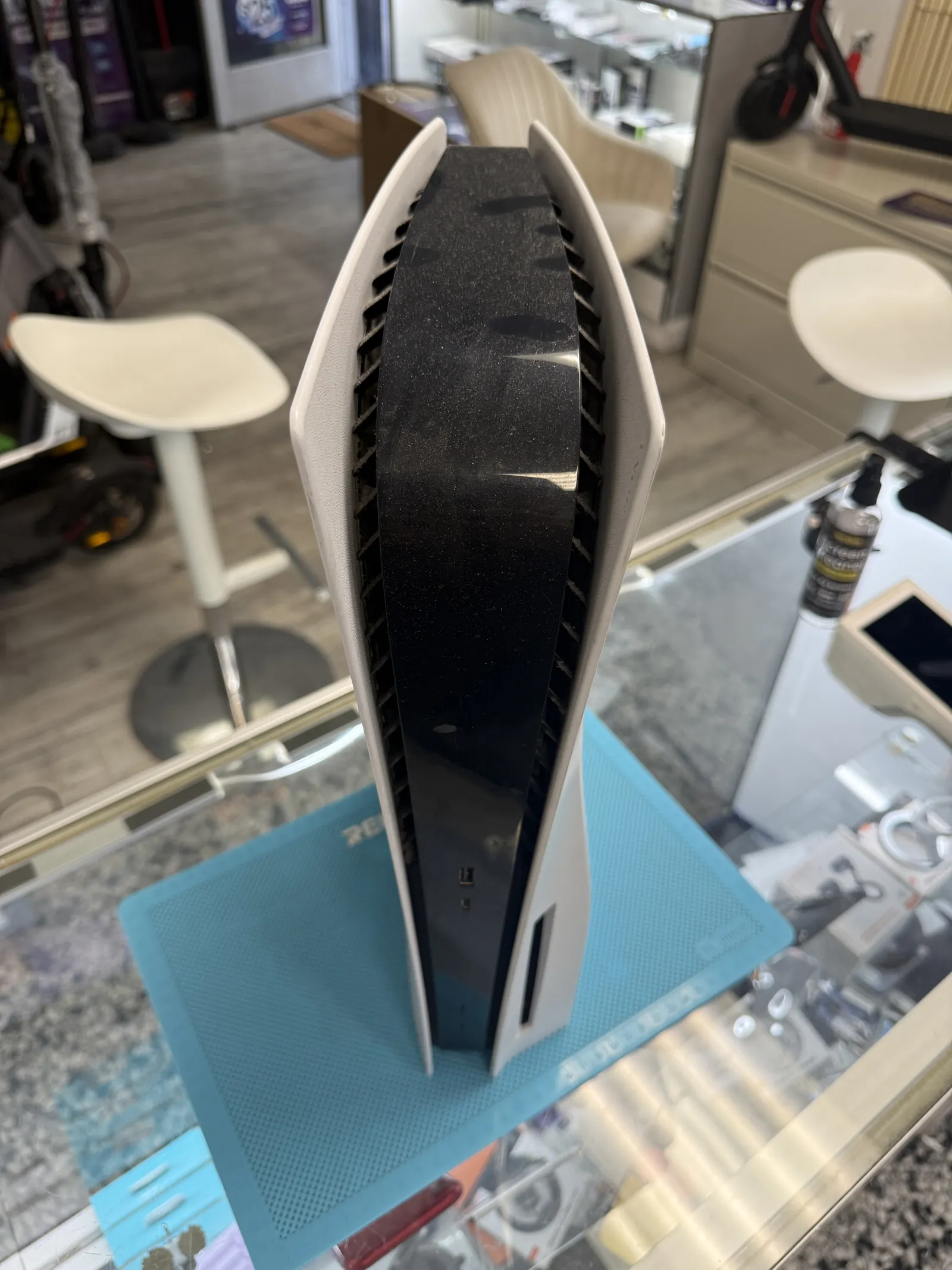 Dust visible across the top of the PS5 before the teardown