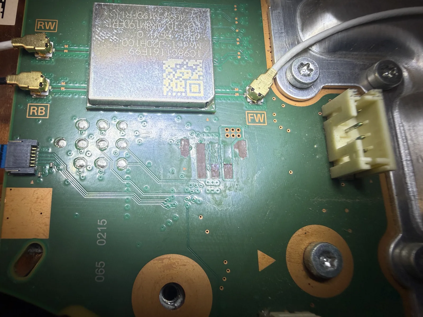 The bare pads on the PS5 motherboard where the fan connector was ripped away