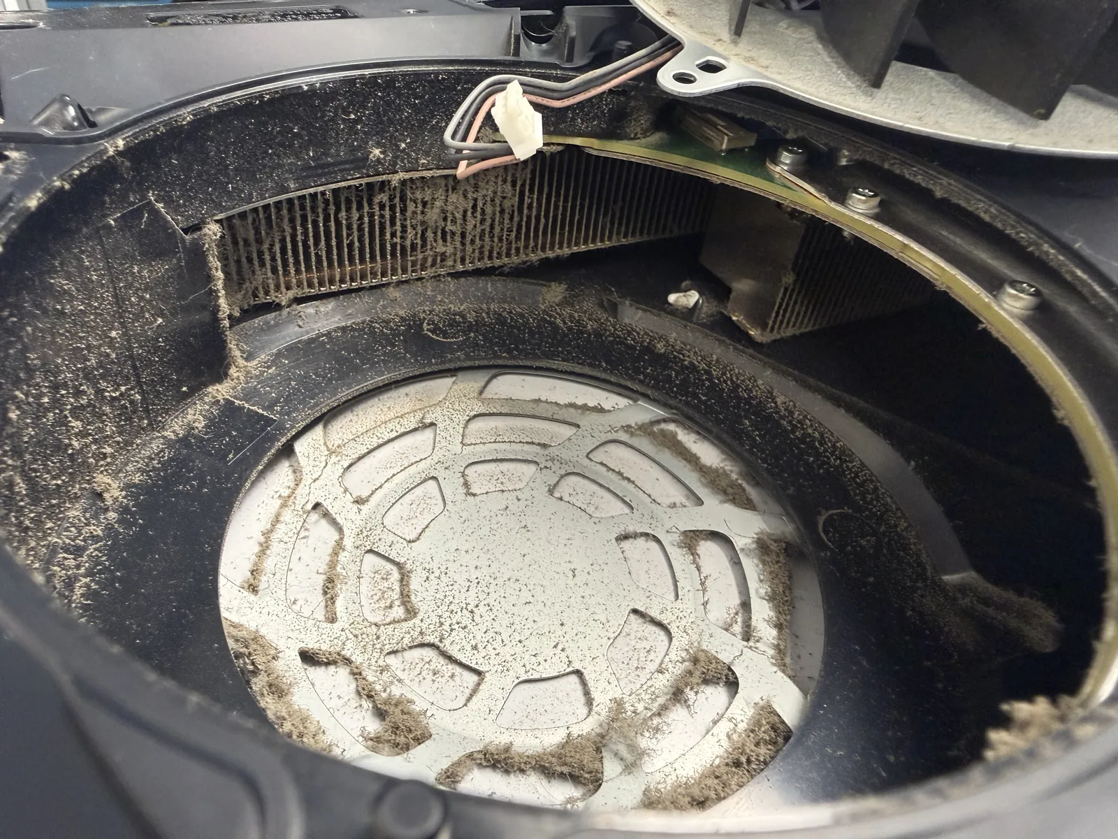 PS5 heatsink fins packed solid with dust and lint