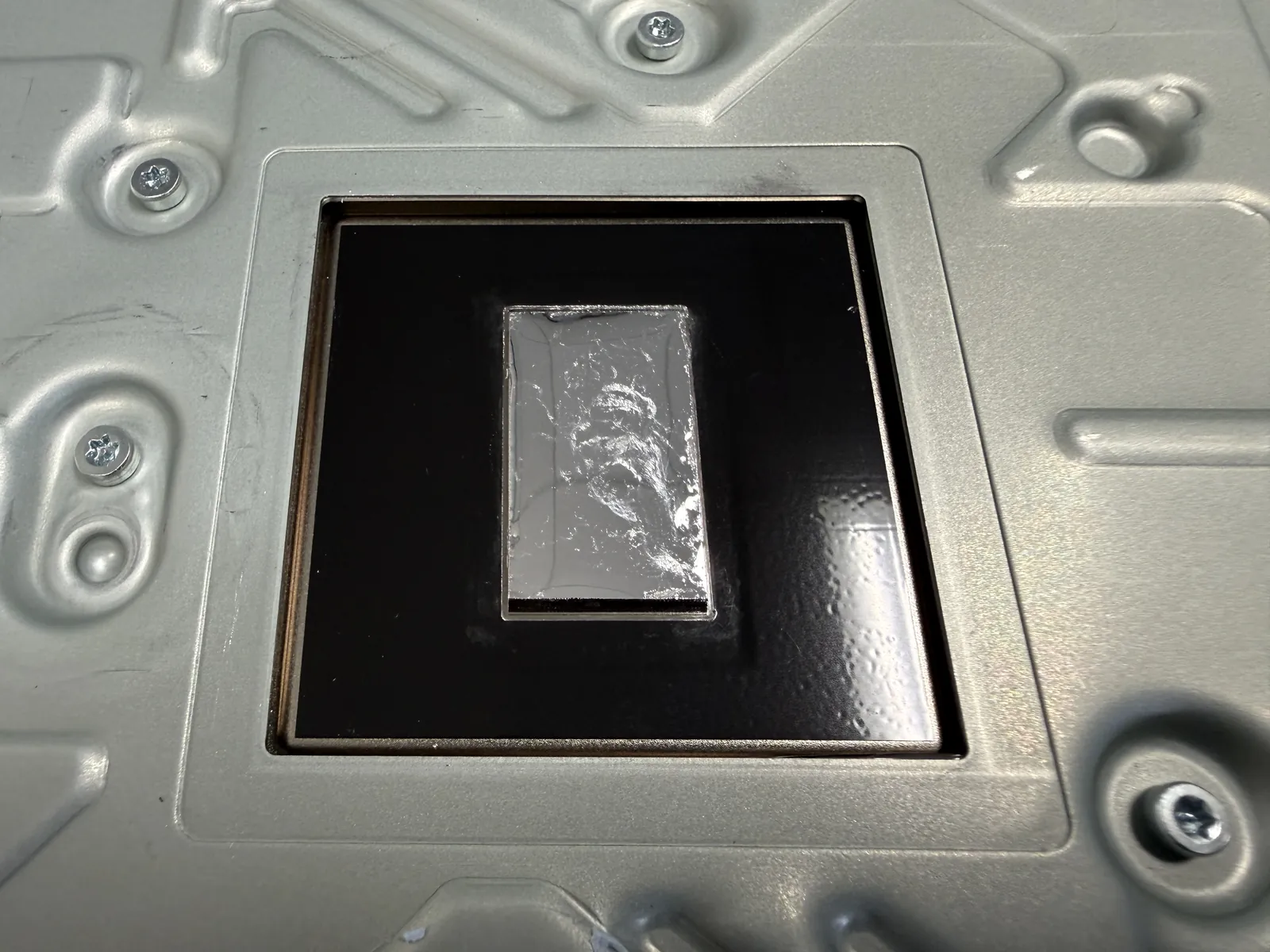 New liquid metal fully spread across the PS5 APU, smooth with no stickiness