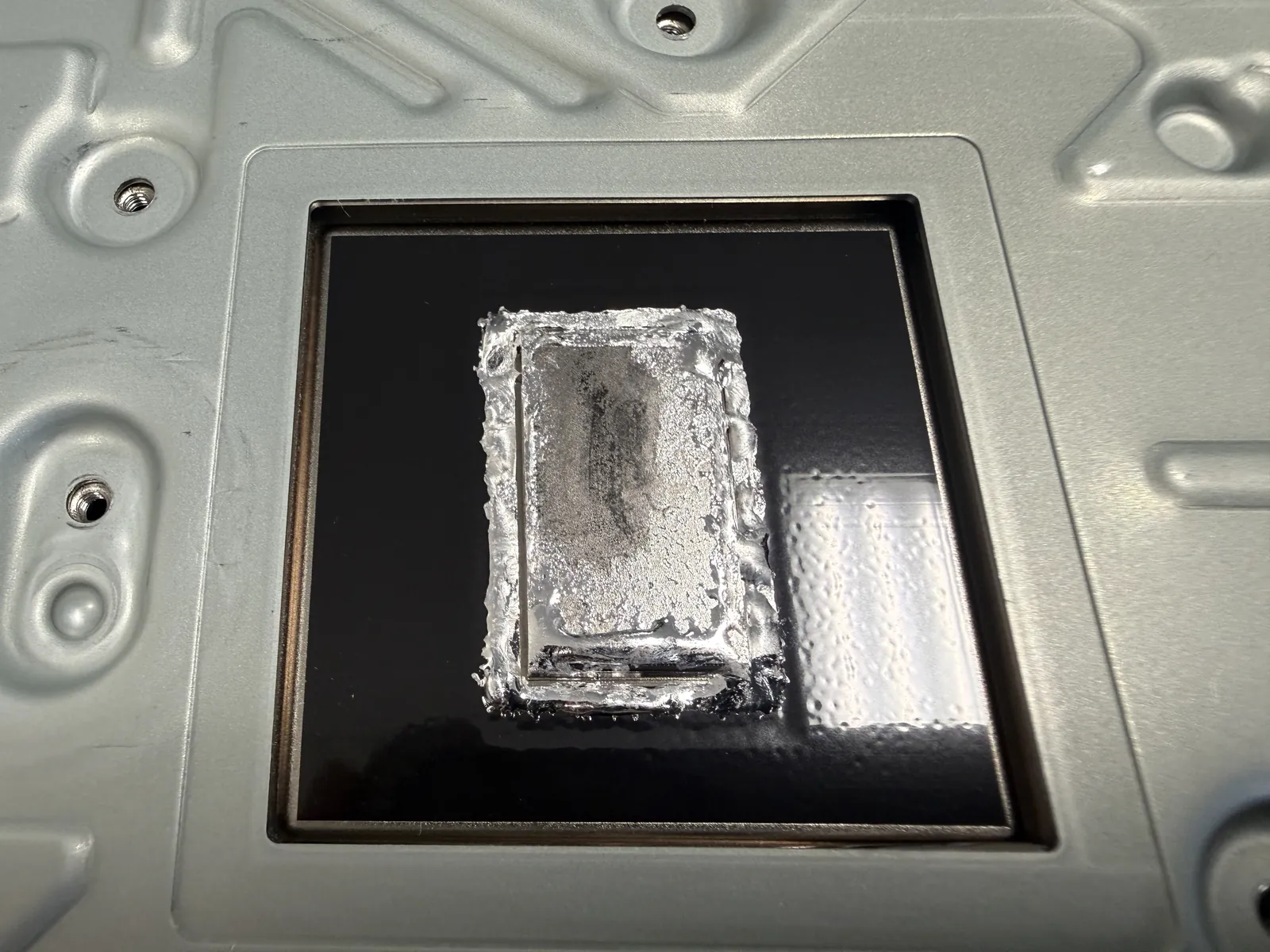The old PS5 liquid metal, dried out and sticky on the cold plate