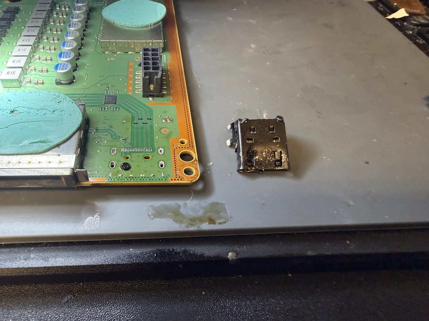 Old Xbox Series X HDMI port removed and the board pads cleaned